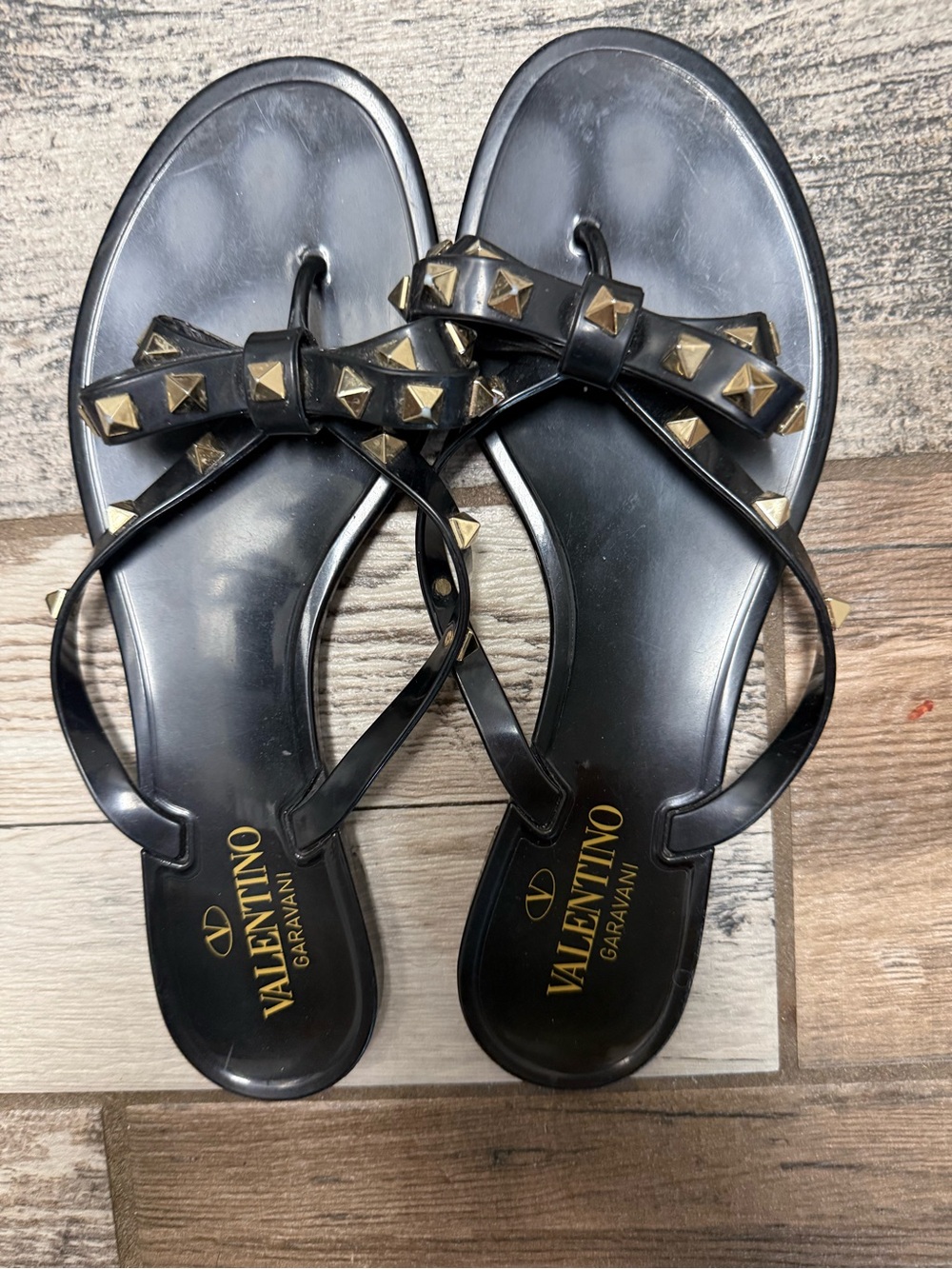 Valentino Garavani Black Bow Jelly Sandals with Gold Studs